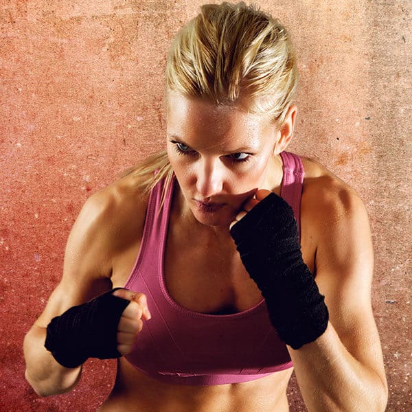 Mixed Martial Arts Lessons for Adults in Gilbert AZ - Lady Kickboxing Focused Background