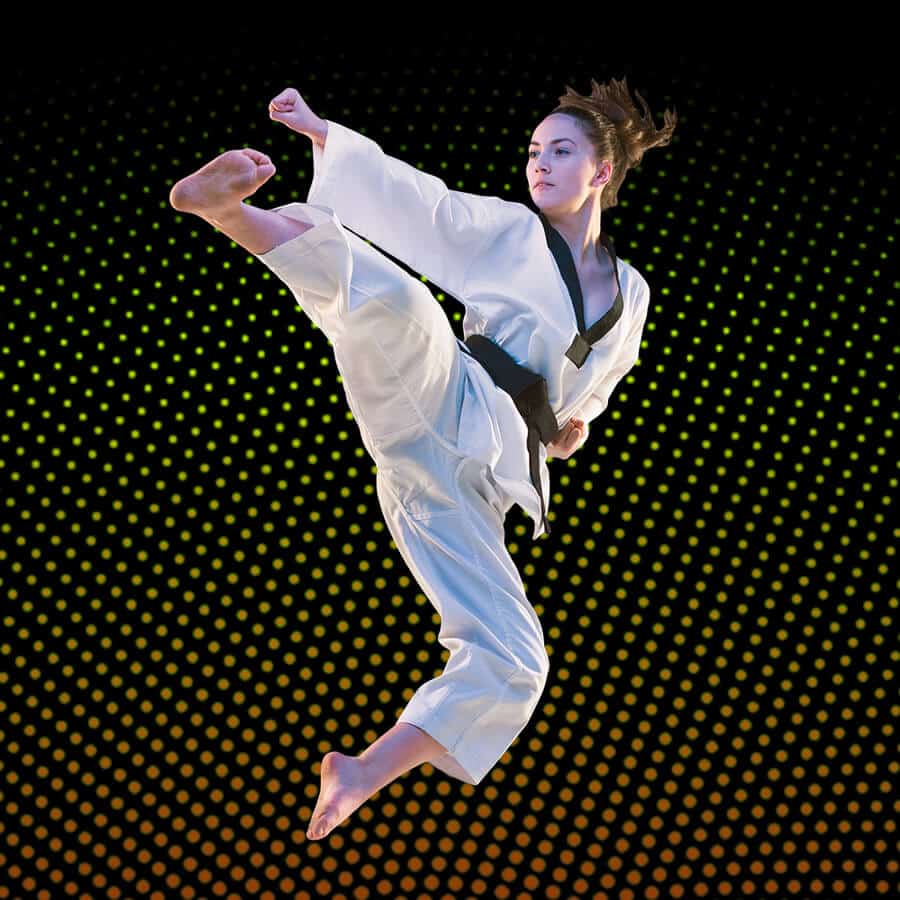 Martial Arts Lessons for Adults in Gilbert AZ - Girl Black Belt Jumping High Kick